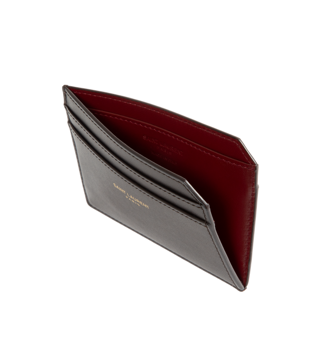 Image 3 of 3 - BROWN - Saint Laurent Mens Card Case is crafted from calfskin leather. Features an embossed Saint Laurent Paris logo, contrasting interior, seven card slots, and bronze-tone hardware. Dimensions: 10.7 7.5 0.5 cm. Main Material: Calfskin Leather. Made in Italy.