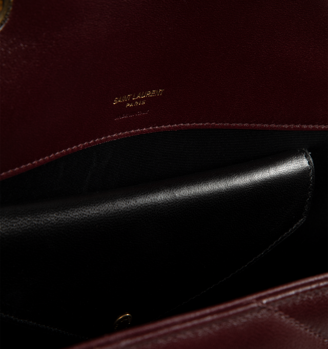 Image 4 of 4 - RED - SAINT LAURENT Loulou Medium Bag featuring chain bag in soft lambskin with chevron-quilted topstitching, removable leather pouch and pocket mirror, sliding chain strap, grosgrain lining, bronze-toned hardware, magnetic snap closure and one flat pocket. 11.4" x 6.7" x 3.1". Single strap drop: 17.7". Doubled strap drop: 8.7". Lambskin, brass. Made in Italy.