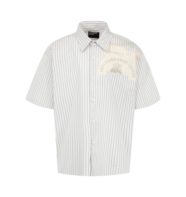 Image 1 of 2 - WHITE - Enfants Riches Dprims Men's Anti-Communist League Short Sleeve Shirt is crafted from Italian striped cotton shirting and features a pointed collar, mother-of-pearl button closure, a left chest pocket with a printed artwork patch, short sleeves, and a square hem. This designer cotton shirt combines workwear-inspired tailoring with signature graphic detailing for elevated everyday wear. Main Material: Cotton. Made in Italy.