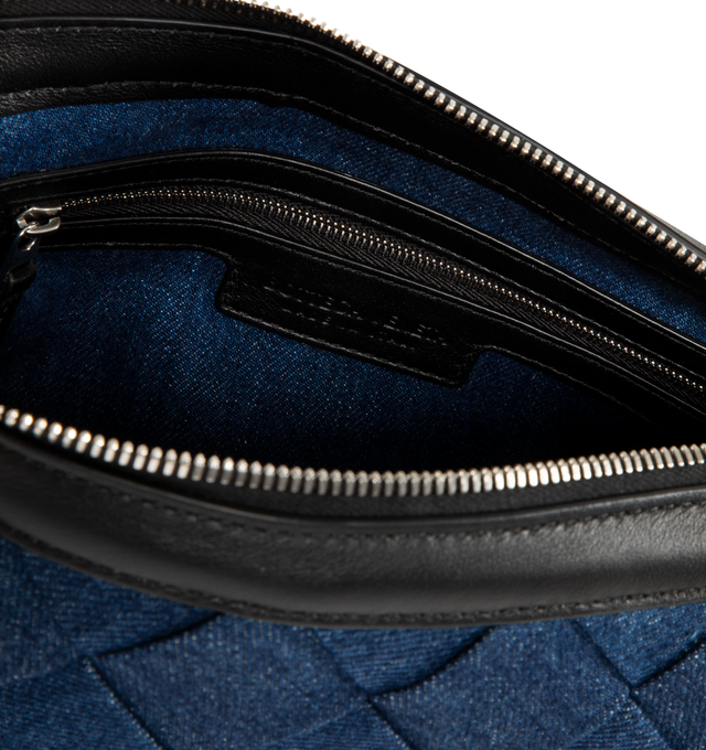 Image 3 of 3 - BLUE - BOTTEGA VENETA Zipped Messenger Bag featuring zipped cross-body bag in denim Intreccio with adjustable strap, single interior zipped pocket and two flat open pockets and zipper closure. 5.9" x 9.8" x 2". Strap drop: 19.7". Canvas. Made in Italy.