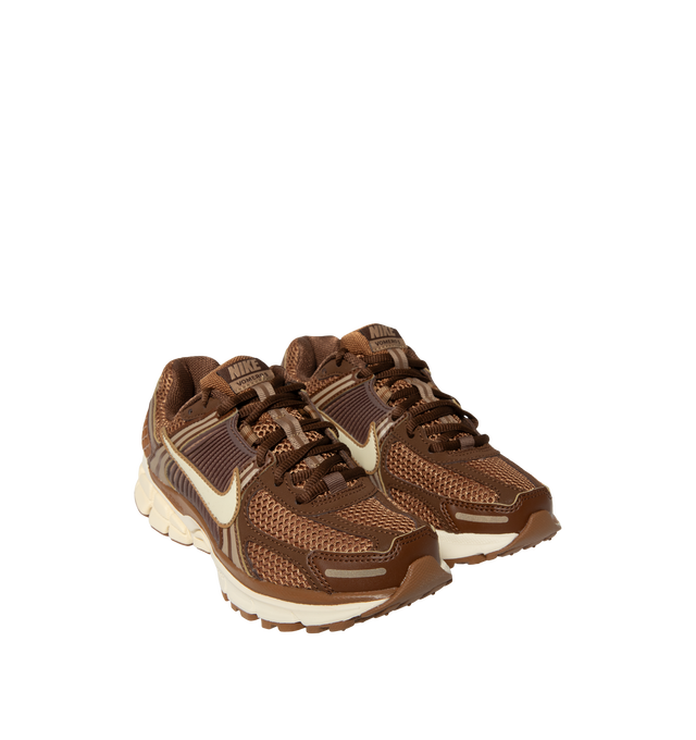Image 2 of 5 - BROWN - Nike Womens Zoom Vomero 5 Sneakers feature a layered design with textile, synthetic leather, and plastic accents. Finished with Zoom Air cushioning, supportive side caging, reflective details, and a durable rubber outsole. Main Material: Textile, Synthetic Leather, Plastic; Outsole: Rubber. Imported