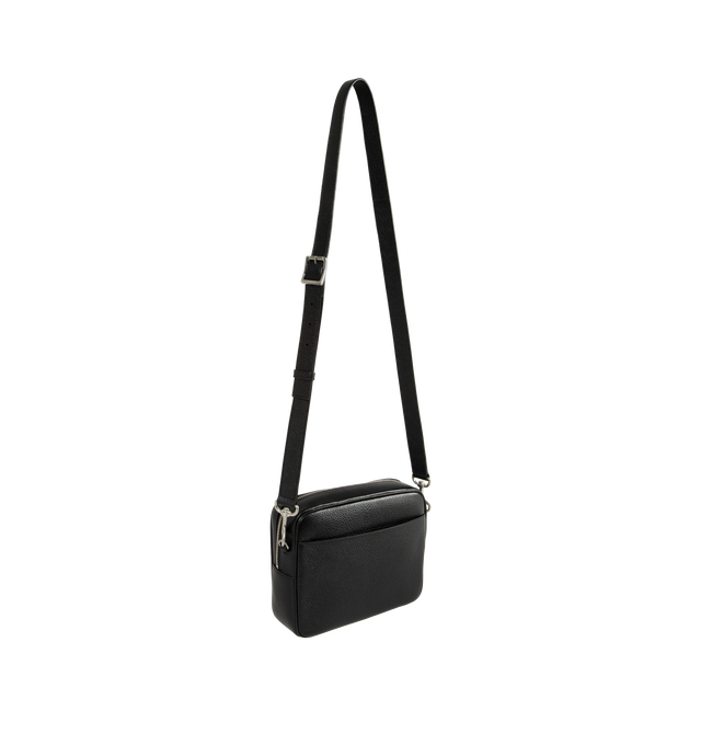 Image 2 of 3 - BLACK - Saint Laurent Men's Small Leather Camera Bag is crafted from grained leather and features a compact camera bag silhouette accented by the maison's signature lettered logo. Designed for everyday versatility, this style is finished with a removable and adjustable shoulder strap, a top zip closure, silver-tone hardware, and multiple pockets for organized storage. Main Material: Grained Leather. Hardware: Silver-Tone. Closure: Top Zip. Strap: Removable and Adjustable Shoulder Strap. Exter