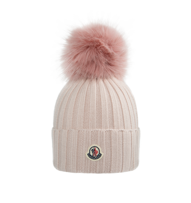 Image 1 of 2 - PINK - MONCLER Pom Pom Beanie featuring ultra-fine Merino wool, faux fur pom pom, rib knit and Gauge 5. 100% virgin wool. Made in Bulgaria. 