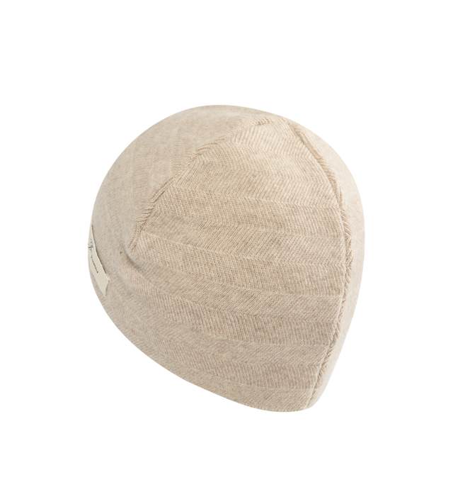 Image 2 of 3 - CHAMPAGNE - JACQUEMUS Chevron Knit Beanie in wool and cashmere featuring chevron pattern knit, unfolded shape and logo tag embroidered on the side. 70% virgin wool, 30% cashmere. Made in Italy.