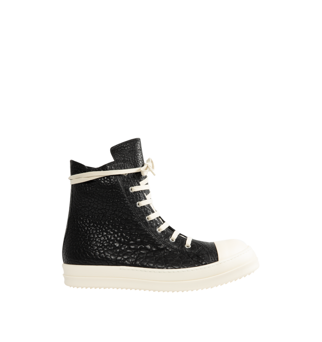 Image 1 of 5 - BLACK - Rick Owens Mens High-Top Sneakers feature a pebbled lamb leather and full-grain calf leather upper. Designed with a high-top silhouette, cream rope laces, off-white rubber toe cap, chunky ridged rubber cupsole, and lace-up closure. Upper: Lamb Leather and Calf Leather; Outsole: Rubber. Made in Italy.