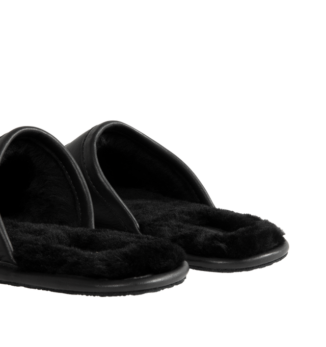 Image 3 of 4 - BLACK - UGG x Willy Chavarria Leather Hotel Slippers are crafted from black leather and feature a luxury reinterpretation of the classic hotel slipper silhouette. Designed with Chavarria's crest embroidered, and lined with UGG's signature plush sheepskin for exceptional comfort. Main Material: Leather. Lining: Sheepskin. Unisex style in men's sizes.