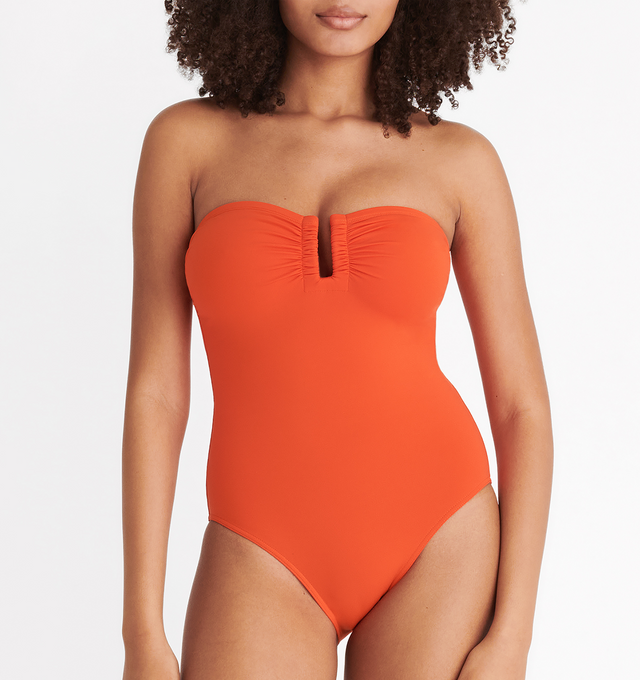 Image 4 of 6 - ORANGE - ERES Cassiope One-Piece Bustier Swimsuit featuring bust shirring at front and sides, U-shaped metal link between cups and gripper tape. Main: 84% Polyamid, 16% Spandex. Second: 68% Polyamid, 32% Spandex. Made in Italy. 