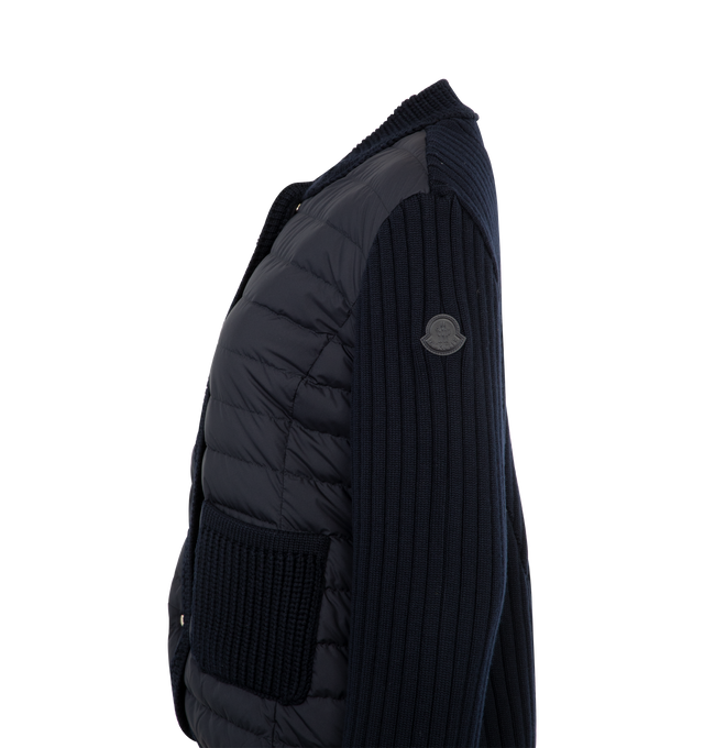 Image 3 of 3 - NAVY - MONCLER Padded Wool Cardigan featuring Merino wool, polyester lining, down-filled polyester front, gauge 7, collar, snap button closure, patch pockets and leather logo patch. 100% polyester. 100% virgin wool. Padding: 90% down, 10% feather. Made in Moldova.