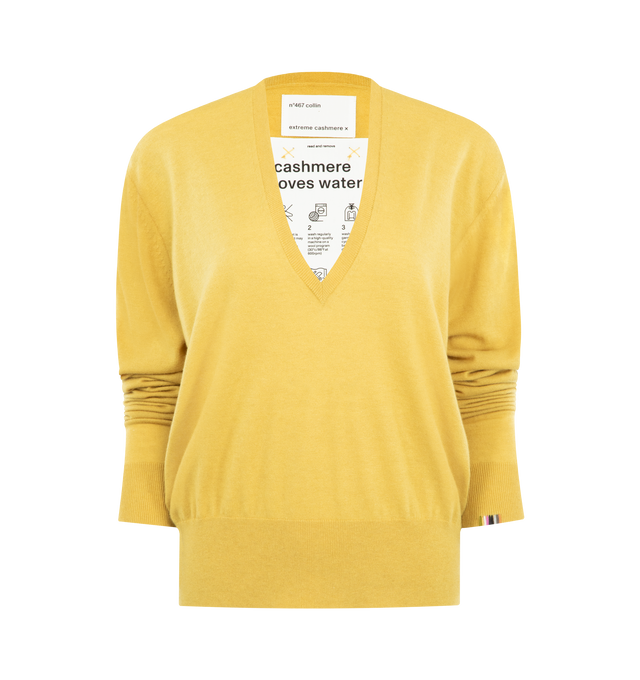 Image 1 of 2 - YELLOW - EXTREME CASHMERE Collin Sweater featuring a regular fit, deep v-neckline, fine-knit wool cashmere blend and ribbed neck, hem and cuff details. 70% merino wool, 30% cashmere.