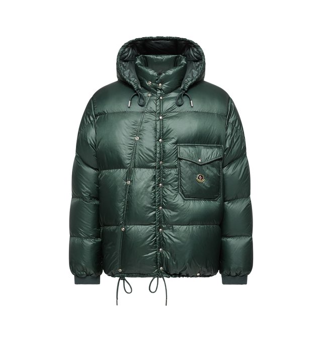 Image 1 of 1 - GREEN - Moncler Men's Karakorum Jacket is crafted from lightweight nylon and features a stand collar with a drawstring hood, a front zip closure with snap-button placket, and down-filled insulation for cold-weather protection. Designed with side pockets, a flap chest pocket, allover panel construction, and an adjustable drawstring hem, this versatile outerwear style balances functionality with everyday wearability. Main Material: 100% Polyamide. Lining: 100% Polyamide. Padding: 90% Down, 10%