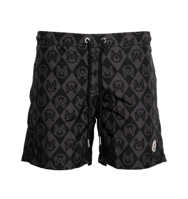 Image 1 of 3 - BLACK - MONCLER Monogram Print Swim Shorts featuring waistband with drawstring fastening and back patch pocket. 100% polyester. 