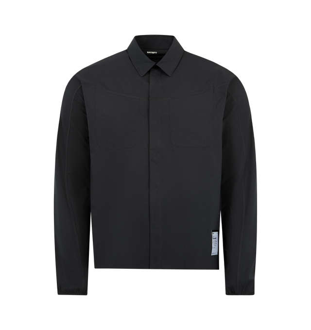Image 1 of 3 - BLACK - SATISFY PeaceShell River Shirt featuring 2 ice pockets on upper back for mid-race cooling, 2 rapid-access chest pockets for small cargo, lightweight invisible snap button closure, cinched cuffs and flatlock seam construction for friction-free movement, stealth-reflective SATISFY print for low-light visibility and exterior detachable care label. 100% recycled polyester.