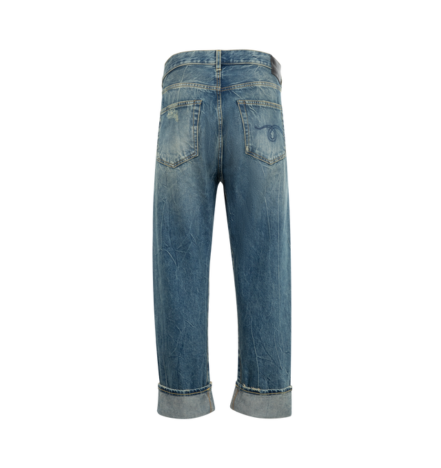 Image 2 of 3 - BLUE - R13 Crossover Jeans featuring fading, whiskering, and distressing throughout, belt loops, five-pocket styling, offset button-fly, raw edge at rolled cuffs and logo patch at back waistband. 100% cotton. Made in Italy.