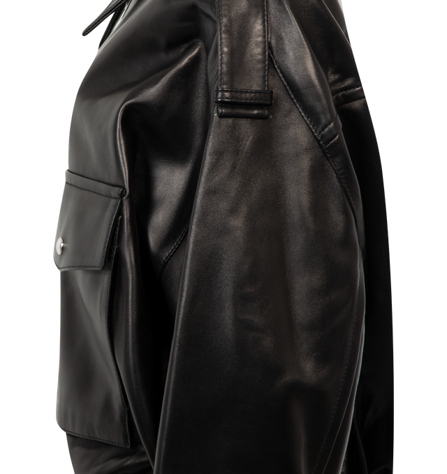 Image 3 of 3 - BLACK - KHAITE Owey Jacket featuring a sculptural bomber in exceptionally soft and lightweight plong leather, relaxed fit, rounded blouson silhouette, dropped shoulder seams, ruching at banded hem, elongated collar, epaulets, and sleeves, signature hardware at two-way zipper, patch pockets at front and lined in silky cupro twill. 100% lamb.