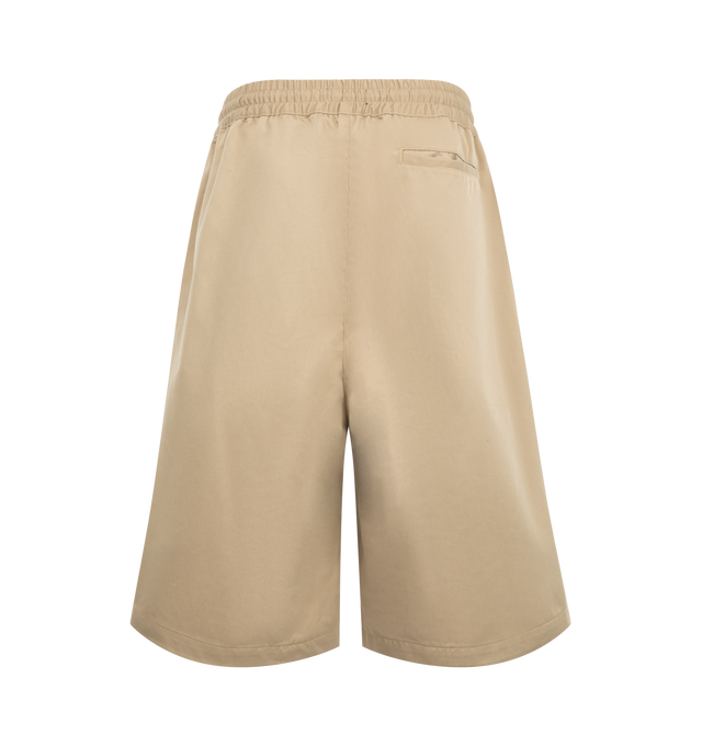 Image 2 of 3 - NEUTRAL - Willy Chavarria Orale Elasticated Short is crafted from a polyester-cotton blend and features a relaxed, voluminous silhouette with an elasticated waistband for everyday comfort. Designed with the brand's signature oversized proportions and clean utility-inspired styling. Main Material: 65% Polyester, 35% Cotton. Lining: 100% Cotton. Made in USA.