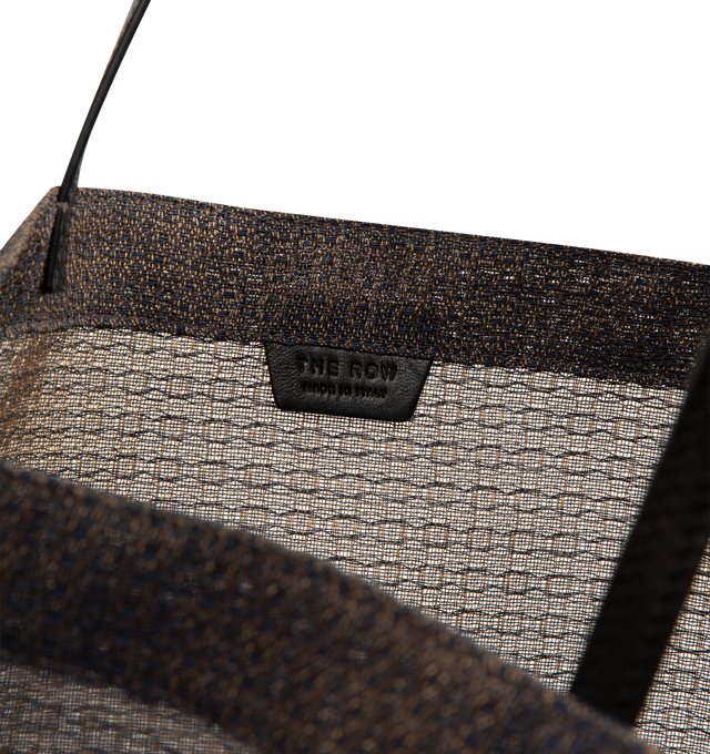 Image 3 of 3 - BROWN - THE ROW Mesh Barn Tote Bag in woven mesh with saddle leather top handles and single interior pocket. Measures 14 x 6 x 15 inches with 10 inch handle drop. 80% polyurethane, 20% polyester. Unlined. Made in Italy.