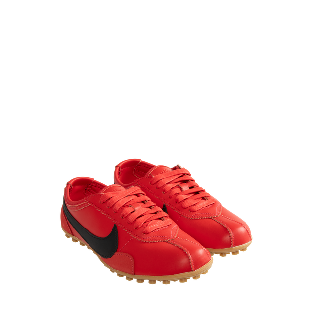 Image 2 of 5 - RED - Nike Women's Moon Shoe Sneakers are designed with a premium full-grain leather upper and the brand's iconic Waffle outsole, this heritage-inspired style captures the look and feel of a classic 1970s runner while delivering everyday comfort and durability. Main Material: Full-Grain Leather Upper. Outsole: Rubber Waffle Sole.
