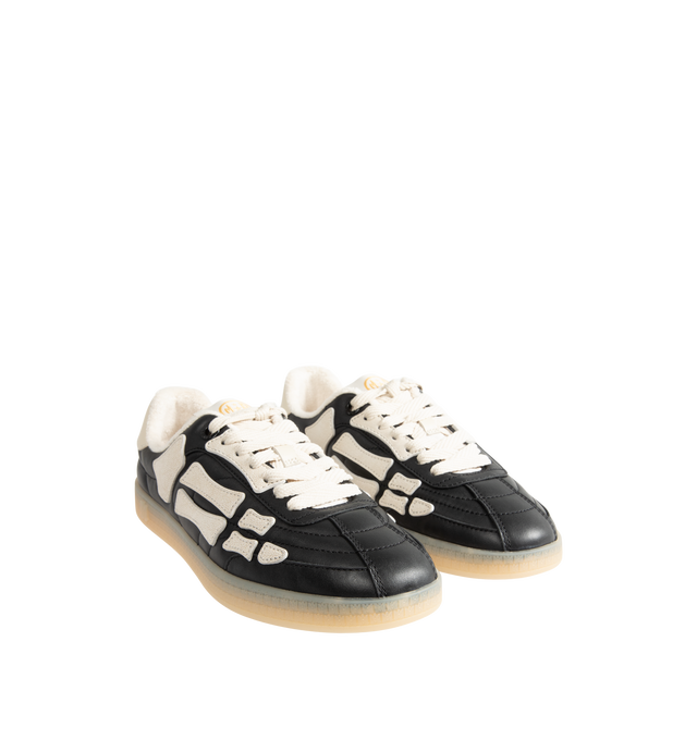Image 2 of 5 - BLACK - Amiri Mens Pacific Football Sneakers are crafted with a leather upper and signature pebbled leather bone appliqus. Feature contrast topstitching, lace-up closure, padded collar, two-tone rubber sole, and low-top silhouette. Main Material: Leather Upper; Sole: Rubber. Made in Vietnam.