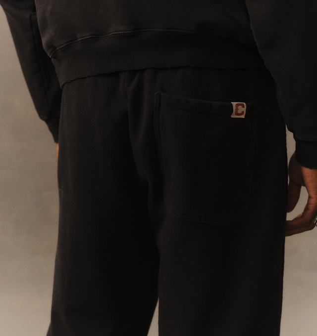 Image 6 of 6 - BLACK - Cherry LA Chevron Parachute Sweatpants are crafted from custom cotton fleece and feature a wide-leg silhouette with a relaxed, laid-back fit. Designed with a patch detail at the leg, an adjustable drawcord waistband, and a branded label at the back pocket, these everyday sweatpants blend comfort-focused construction with Cherry LA's signature contemporary aesthetic. Main Material: Custom Cotton Fleece. Made in Los Angeles, USA.