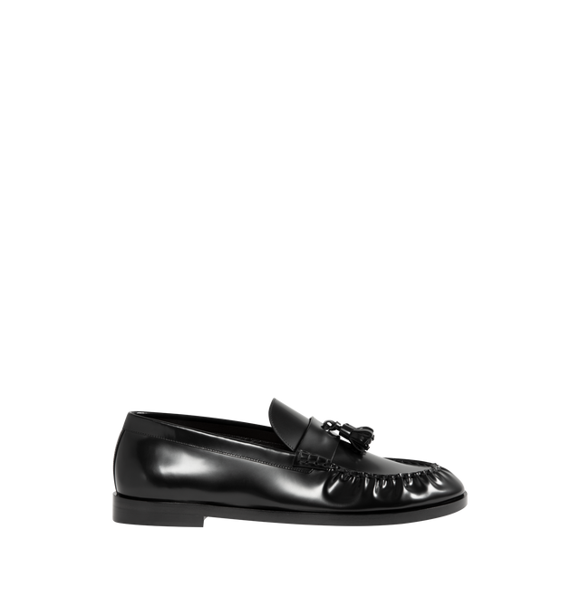Image 1 of 4 - BLACK - THE ROW Loafers featuring tassel detail at strap, ruched welt stitching and box calf leather upper and sole. Made in Italy.