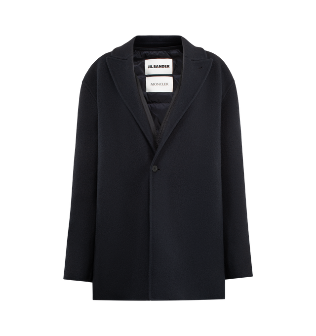 Image 1 of 4 - NAVY - MONCLER GENIUS X JIL SANDER Rhamnose 3-in-1 Wool Mono-Breasted Down Jacket featuring double wool, viscose lining, detachable down-filled nylon inner with snap button closure, button closure and detachable metal logo pin. 100% virgin wool. Lining: 100% viscose/rayon. 100% polyamide/nylon. Padding: 90% down, 10% feather. Made in Italy.