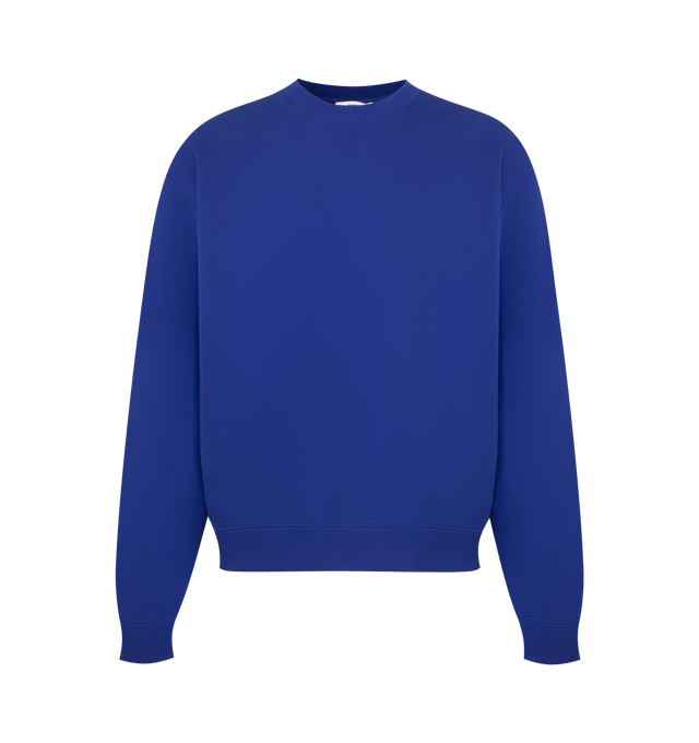 Image 1 of 3 - BLUE - Jil Sander Men's Cotton Terry Crew-Neck Sweatshirt is crafted from lightweight cotton terry and features a relaxed-fit silhouette with slightly dropped shoulders. Designed with a ribbed crew neck, hem and cuffs, and a vertical printed Jil Sander logo that reflects the brand's clean, modern aesthetic. Main Material: 100% Cotton. Made in Italy.