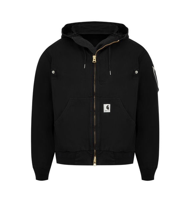 Image 1 of 3 - BLACK - SACAI X CARHARTT WIP Washed Duck Hooded Jacket featuring drawstring hood, drop shoulders, long sleeves, sleeve zip pocket, split kangaroo pocket, rib-knit trim and two-way front zip closure. 100% cotton. 100% nylon. Made in Japan.
