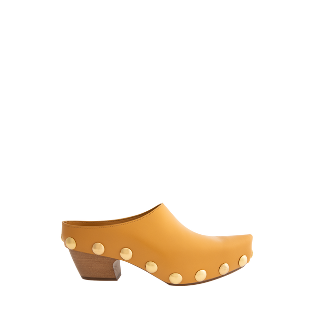 Image 1 of 4 - YELLOW - BOTTEGA VENETA Gondola Clog featuring shiny calf leather with metal stud detailing and beech wood platform. Lining: Calfskin. Lugged rubber outsole. Made in Italy.