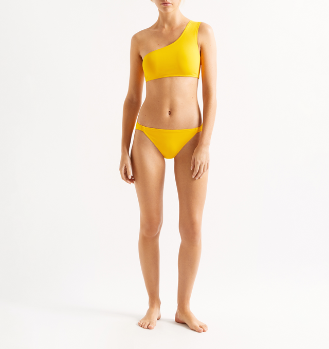 Image 2 of 5 - YELLOW - ERES Symbole One-Shoulder Bikini Crop Top featuring one-shoulder bikini crop top and broad strap. 84% Polyamid, 16% Spandex. Made in Italy. 