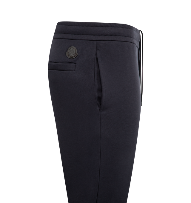 Image 3 of 3 - NAVY - MONCLER Sweat Bottoms featuring comfort cotton gabardine, waistband with concealed drawstring, side pockets and back welt pocket. Cotton.