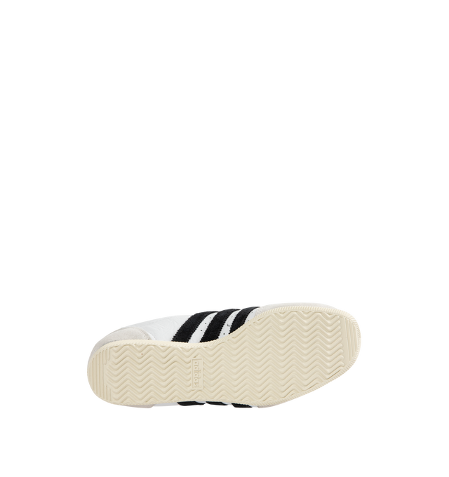 Image 4 of 5 - WHITE - Adidas Japan Sneakers are a lace-up style with leather uppers, EVA midsoles, molded heels, low-profie design, double-stitched T-toes and rubber gum soles.  Reissued vitage design from a 1964 trainer that appeared in a catalog for that year's global sporting event held in Japan. Unisex style in men's sizing.