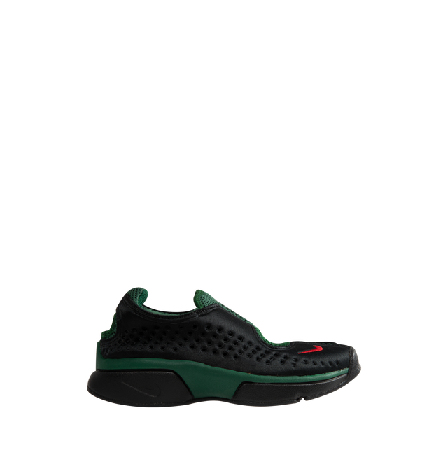 Image 1 of 5 - BLACK - Nike Women's Air Rift 2 Kenya Sneakers reinterpret the iconic split-toe silhouette with a colorway inspired by Kenya and its renowned running heritage. Designed in black, Fire Red, and Team Dark Green, these sneakers reference the colors of the Kenyan flag while honoring the barefoot running traditions that originally influenced the Air Rift design. The updated Air Rift 2 construction retains the distinctive split-toe profile and natural-motion-inspired shape while refining the origin