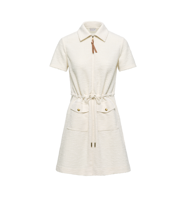 Image 1 of 1 - WHITE - Moncler Womens Boucl Polo Mini Dress is crafted from textured boucl and features a classic polo collar, short sleeves, zip-front closure, snap-button flap pockets, and a signature macram logo patch. This designer mini dress combines a sporty polo-inspired silhouette with rich boucl texture for elevated everyday wear. Main Material: 63% Polyester, 32% Cotton, 3% Viscose, 2% Elastane. Made in Italy.