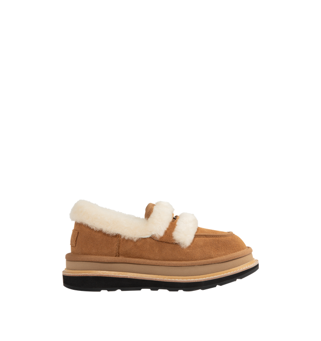 Image 1 of 4 - BROWN - UGG x sacai loafer designed for everyday wear, combines UGG's iconic premium  suede with sacai's unmistakable hybridized aesthetic. Upper is made with suede sourced from certified farms that practice regenerative agriculture upper. Midsole incorporates sugarcane EVA. Features Vibram XS Trek Evo. Unisex style in women's sizes.