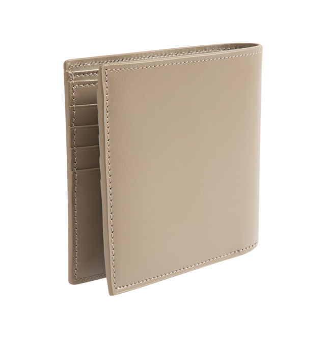 Image 2 of 3 - BROWN - SAINT LAURENT East West Wallet featuring single-fold wallet with embossed signature, leather lining, silver-toned hardware, eight card slots, two bill compartments and two receipt compartments. 4.5" x 3.7" x 0.6". Calfskin leather. Made in Italy.