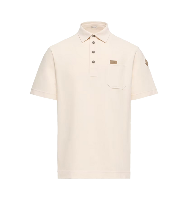 Image 1 of 1 - NEUTRAL - Moncler Mens Leather Logo Tag Cotton Polo Shirt is crafted from cotton piquet. Features a polo collar, short sleeves, snap-button closure, chest pocket with pen holder, leather logo tag, and double leather logo patch. Base Fabric: 100% Cotton; Leather Outer Application: Cow; Leather Tag: Cow. Made in Turkey.