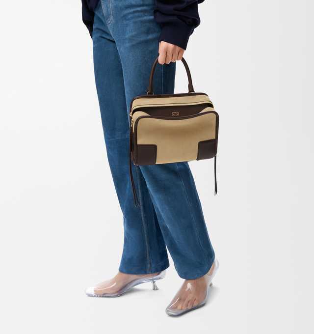 Image 2 of 17 - BROWN - LOEWE Small Amazona 180 Bag in suede featuring a relaxed silhouette anchored by a single toron top handle, designed to be carried open, while a concealed closure secures the main compartment, three carry options: short handle, removable shoulder strap and crossbody, zip closure with two leather zip pullers, two compartments, main compartment closed with magnetic closure, internal flat pocket, left side d-ring for customization, suede and nappa lambskin lining, embossed LOEWE and embo