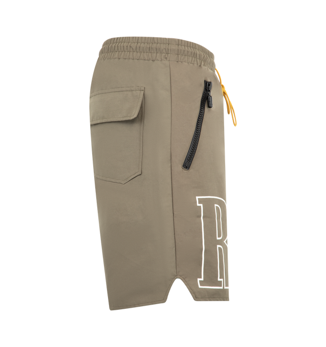 Image 3 of 3 - NEUTRAL - Rhude Mens Nylon Shorts are crafted from premium washed nylon. Feature logo print across the front legs, twin zip pockets with tonal Rhude Pill hardware, and extended drawstrings in signature mustard tone. Main Material: 100% Nylon. Made in the USA.