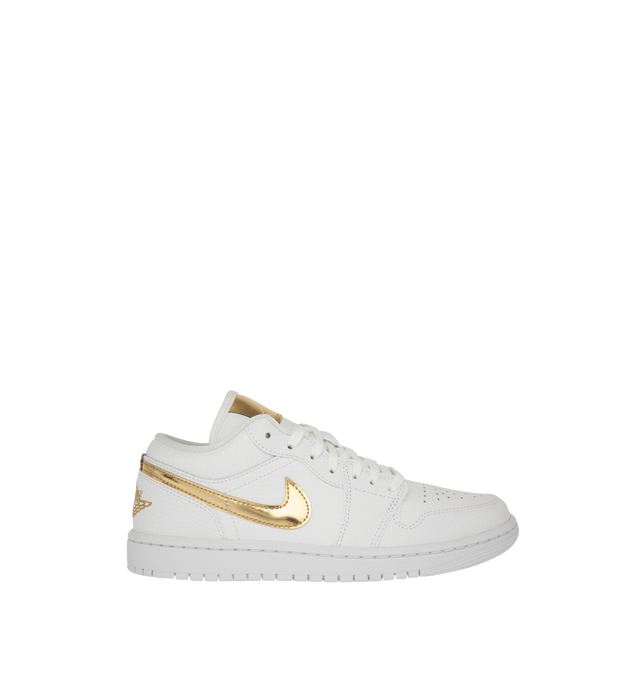 Image 1 of 5 - GOLD - Women's Air Jordan 1 Low SE Sneakers feature a genuine leather upper with signature stitched overlays, a low-top silhouette, and iconic Wings branding for a timeless look. These lifestyle sneakers combine lightweight Air-Sole cushioning, a supportive cupsole construction, and a durable rubber outsole for everyday comfort, stability, and reliable traction. Main Material: Genuine Leather. Midsole: Foam with Air-Sole Unit. Sole: Rubber.