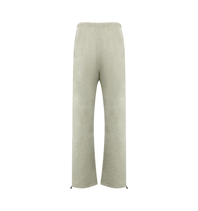 Image 2 of 3 - GREY - FEAR OF GOD ESSENTIALS Relaxed Fleece Sweatpant With Piping made from 380gsm core fleece featuring a relaxed straight leg fit. The embroidered "Essentials" script logo is placed on the leg, while a "Fear of God Essentials" rubberized label is situated at the center front. Key features include side pockets, ankle bungee, and an encased elastic waistband with drawstrings for adjustability. 80% cotton, 20% polyester fleece.