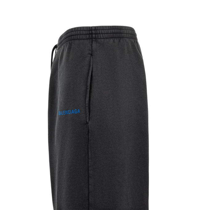 Image 3 of 3 - BLACK - Balenciaga Men's Balenciaga Back Oversized Baggy Sweatpants are crafted from faded black dry cotton fleece and feature a mid-rise, oversized silhouette. An elasticated drawstring waistband, two slash pockets, and Balenciaga logo embroidered at the front complete the design. Main Material: 100% Cotton. Pocket Lining: 100% Cotton. Embroidery: 100% Polyester. Made in Portugal.