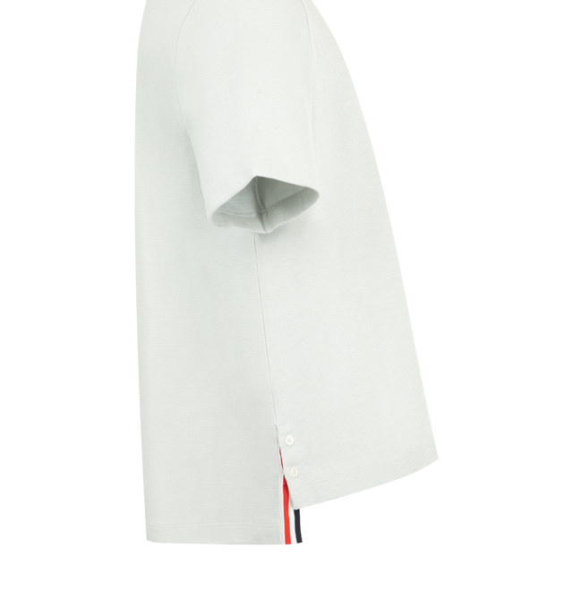 Image 3 of 3 - GREY - THOM BROWNE Textured Cotton Linen Tee featuring a cotton-linen blend, waffled exterior, ribbed neckline, patch chest pocket with knit RWB trim, buttoned side vents with RWB grosgrain trim, stepped hem, name tag appliqu and signature striped grosgrain loop tab. 55% cotton, 36% linen, 7% polyamide, 2% elastane.