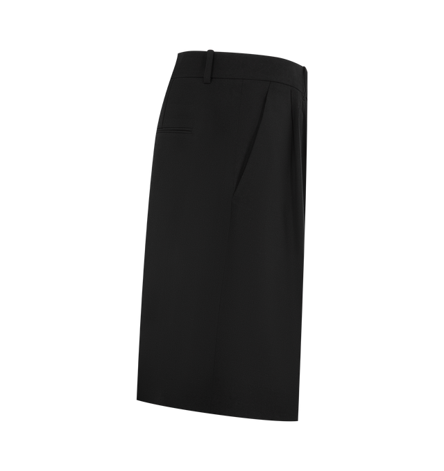 Image 3 of 3 - BLACK - KHAITE Auggie Short featuring a trouser-inspired knee-length short tailored with fluid precision in lightweight wool suiting, paired reverse pleats, belt loops, side pockets and back welt pockets. 100% virgin wool.