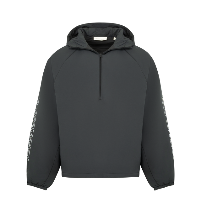Image 1 of 3 - BLACK - FEAR OF GOD ESSENTIALS Tech Nylon Half Zip Anorak Jacket featuring tech nylon-spandex, metallic 3M-printed Essentials graphic on the sleeves, relaxed, rounded silhouette, a hood, raglan sleeves, half-zip front, elasticized cuffs and bungee toggles at the waist hem for adjustable styling and a Fear of God Essentials rubberized label stitched at the center front. 84% nylon, 16% spandex.