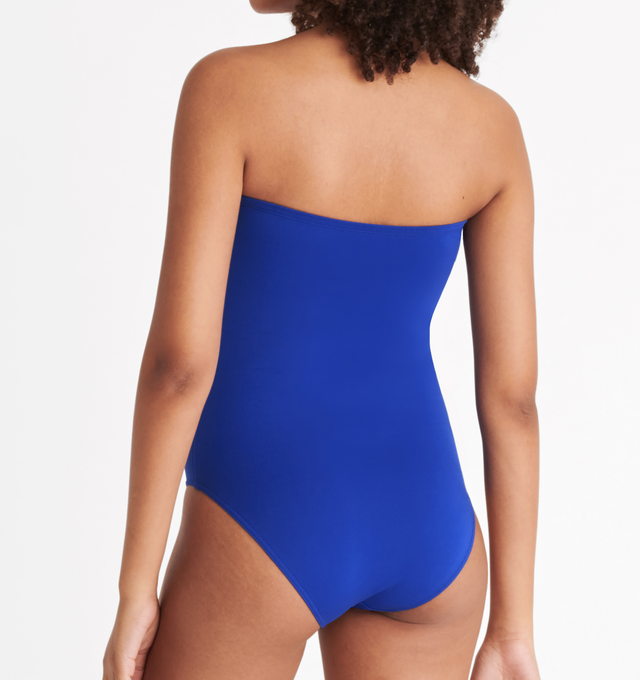 Image 5 of 6 - BLUE - ERES Cassiope One-Piece Bustier Swimsuit featuring bust shirring at front and sides, U-shaped metal link between cups and gripper tape. Main: 84% Polyamid, 16% Spandex. Second: 68% Polyamid, 32% Spandex. Made in Italy. 