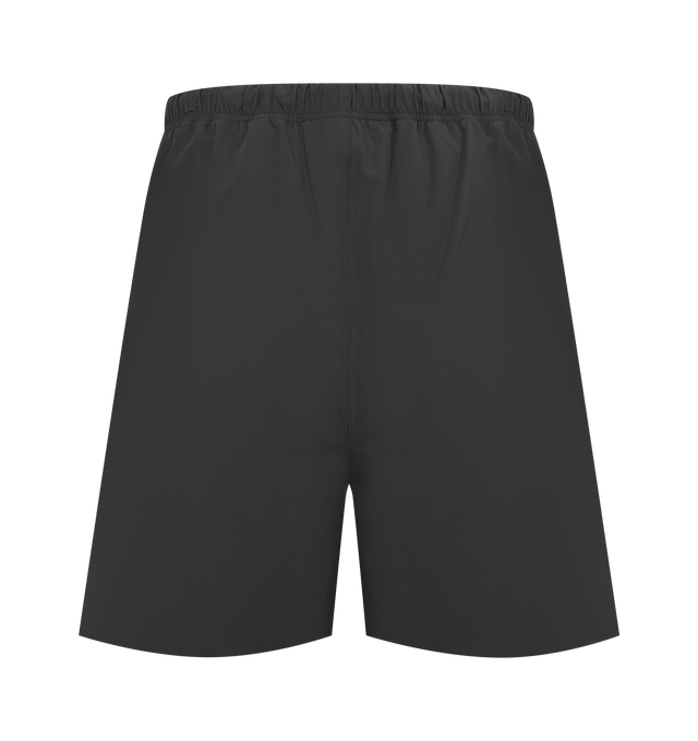 Image 2 of 3 - BLACK - FEAR OF GOD ESSENTIALS Tech Nylon Classic Short featuring a tech nylon-spandex blend, the leg is finished with a metallic 3M-printed Essentials logo, encased elastic waistband with elongated drawcords, side seam pockets and a Fear of God Essentials rubberized label stitched at the center front. 16% spandex, 84% nylon.