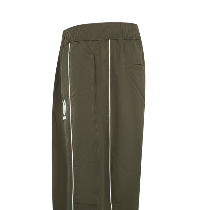 Image 3 of 4 - GREEN - Nahmias Men's Warm Up Pants are crafted from premium performance fabric and feature a relaxed silhouette with an elasticated drawstring waistband, side pockets, and elasticated cuffs for a comfortable athletic-inspired fit. These designer track pants combine everyday functionality with Nahmias' signature luxury streetwear aesthetic, creating a versatile essential for casual wear and coordinated styling. Main Material: Premium Nylon Performance Fabric.