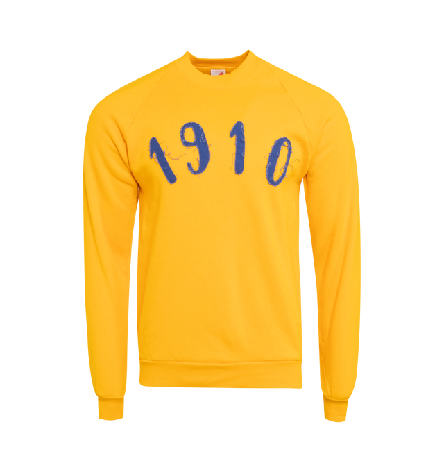 Image 1 of 4 - YELLOW - This yellow upcycled vintage sweatshirt features raglan sleeves, "1910" applique at the front and Transnomadica label at the back. Measurements: 26 inches in length from neckline to front hem, 20 inches from armpit-to-armpit with the size XL on its original vintage tag.This collection of vintage sweatshirts, exclusively for 1910 at Hirshleifers, each featuring a hand-crafted 1910 applique at the front and Transnomadica tag at the back. Each piece features unique fit, color and desi 
