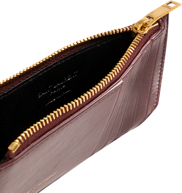 Image 3 of 3 - RED - SAINT LAURENT Card Case in shiny leather featuring zip card holder decorated with logo, leather lining, bronze-tone hardware, five card slots and one zip pocket. 5.1" x 2.9" x 0.3". Calfskin. Made in Italy.