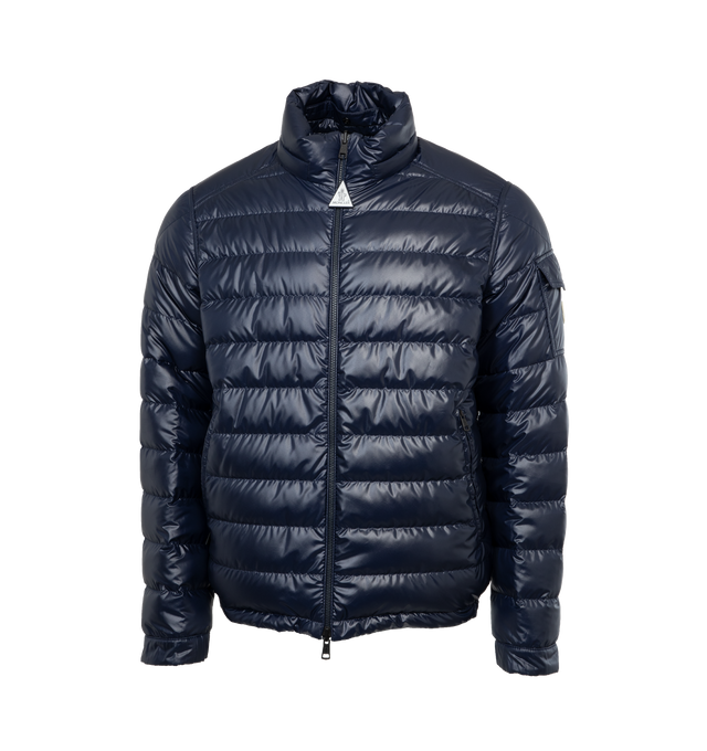 Image 2 of 5 - BLACK - MONCLER TABLASSES JACKET is a short puffer that features one monochrome, boudin-quilted face; while the smooth face boasts a graphic monogram print. The puffer is reversible and has enhanced with a detachable and adjustable hood. This jacket is crafted from polyester, polyester lining, down-filled, collar with snap button closure, reversible zipper closure, zipped pockets and sleeve pocket with snap button closure. EXTERIOR: 100% Polyester LINING: 100% Polyester HOOD LINING: 100% Poly 